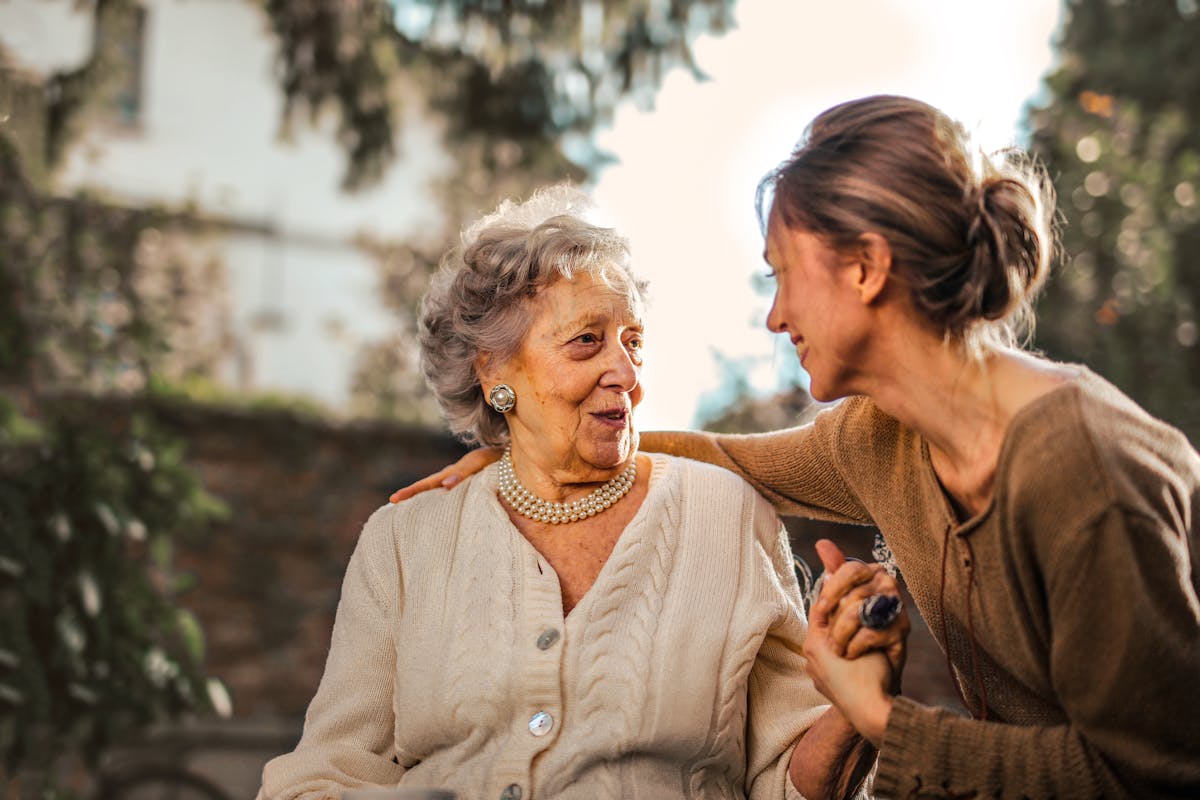 Adult child helping elderly parent understand aged care options